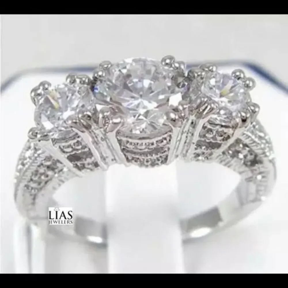 New 18k white gold engagement ring
